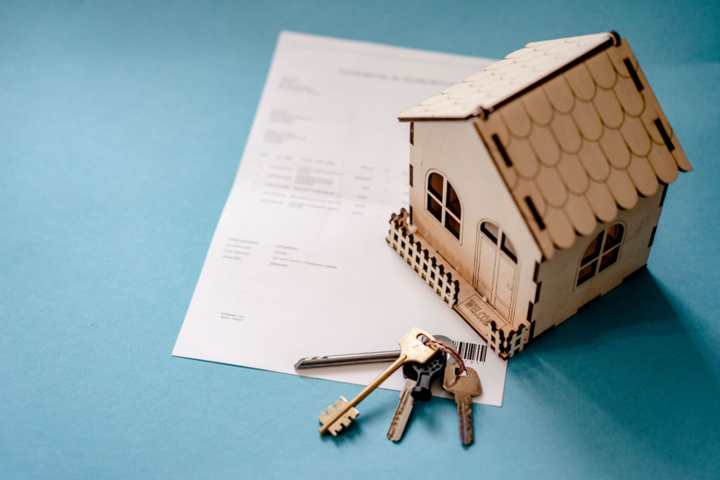 A model of a house on top of papers
