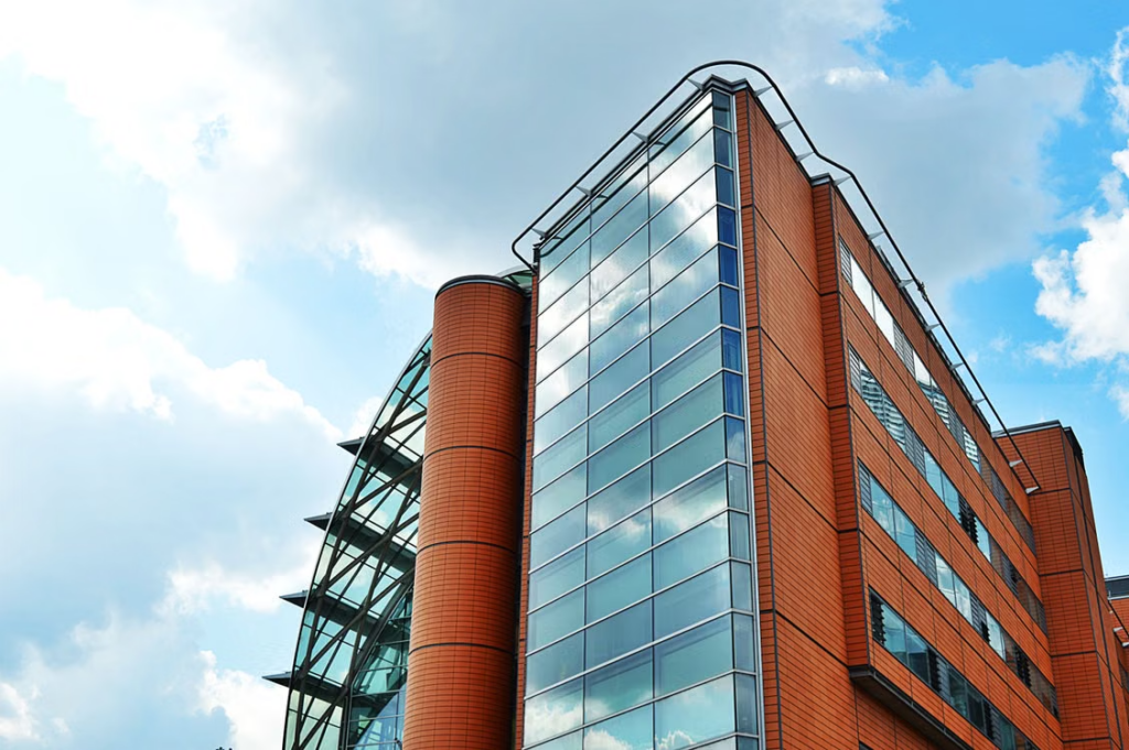 A brown building with glass panels
